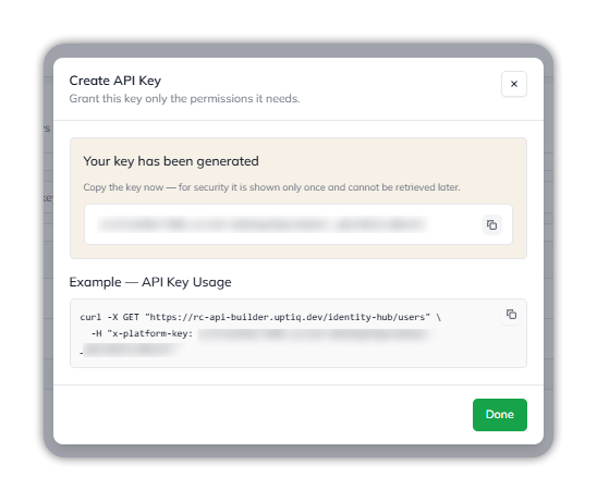 The Create API Key dialog after creation: a Your key has been generated panel with the key hidden and a copy icon, the warning that the key is shown only once and cannot be retrieved later, an Example — API Key Usage curl request with an x-platform-key header, and a Done button